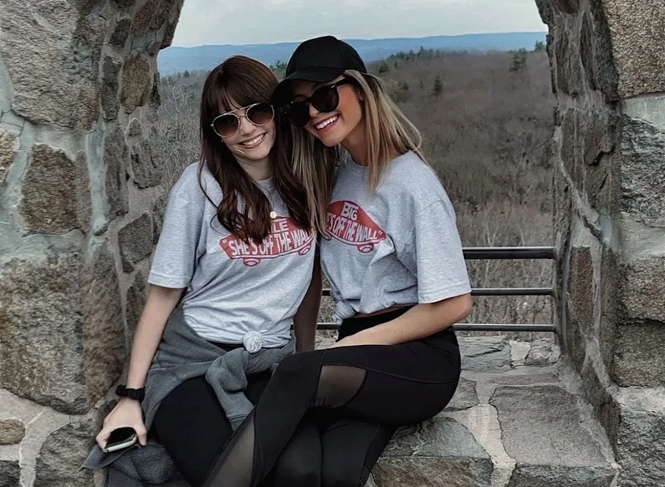Two women smiling at Sleeping Giant on hike