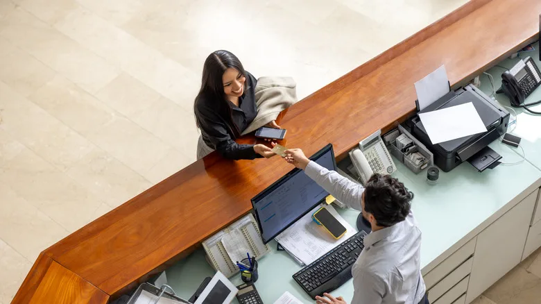 Woman at hotel check in