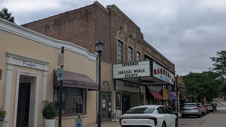 The historic facade of Narberth Reel Cinemas with cars parked in front.