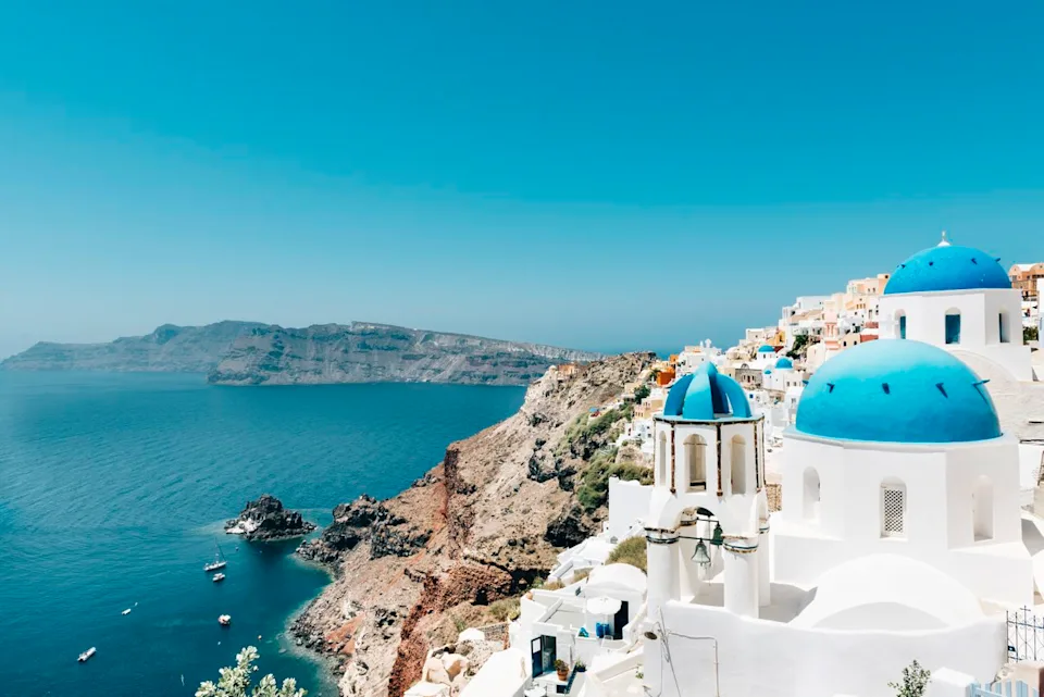 Westend61 / Getty Images Greece's stunning islands—like Santorini—offer retirees a thriving cultural life, not just just postcard views.