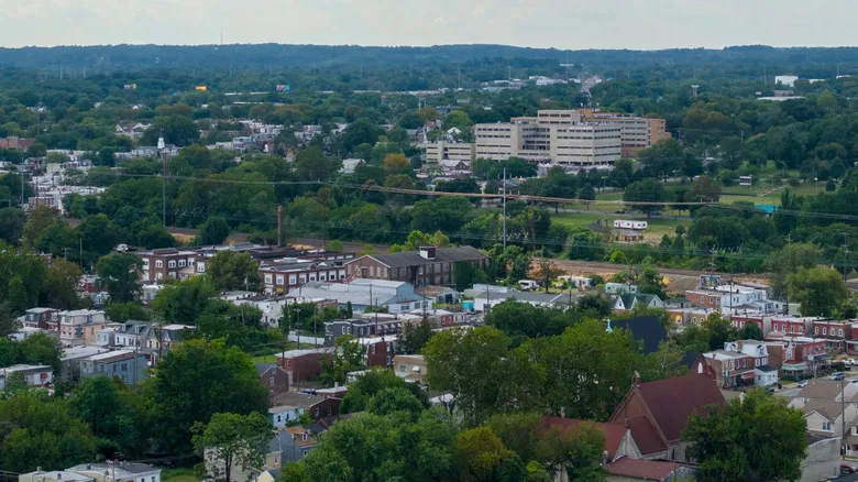 Aerial view of Chester, Pennsylvania, with homes and buildings surrounded by trees