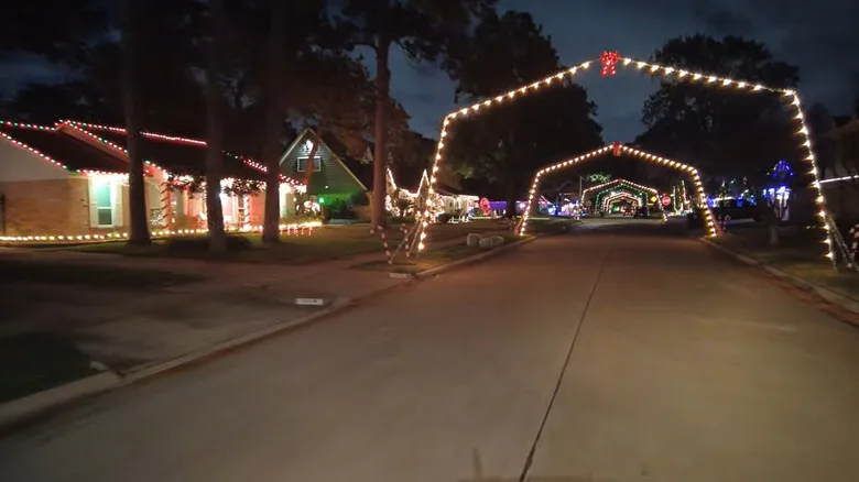 Lighted archways over neighborhood streets during holidays