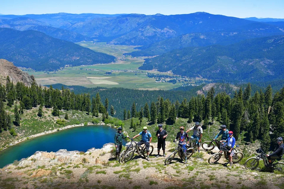 Visit Plumas County Mountain Bikers overlooking Crystal Lake and Mount Hough.
