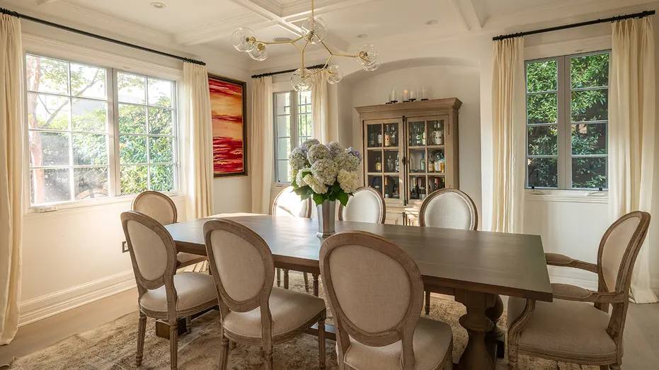 The dining room boasts a table large enough for eight guests.