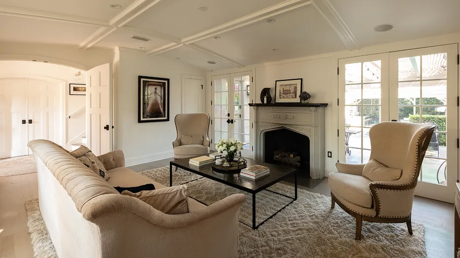 The living room features a wood-burning fireplace.