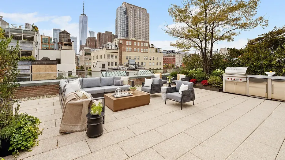 The home also includes 1,000-square-feet of outdoor space with an outdoor kitchen and lounge space.