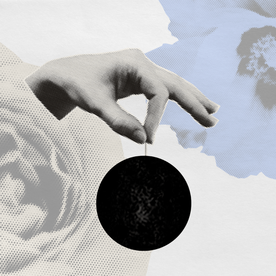  A hand holding a Prenuvo brain scan with two flowers. 