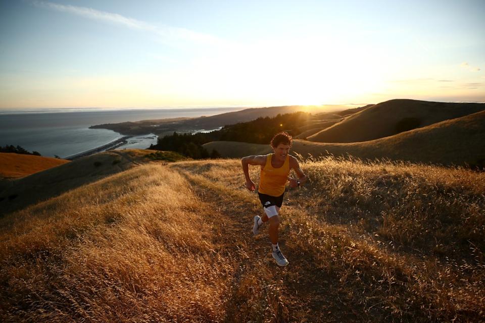 A man runs in Mount Tamalpais State Park in Mill Valley, California, in June 2020. Running is great for heart and respiratory health - but can leave muscles feeling stiff (Getty Images)
