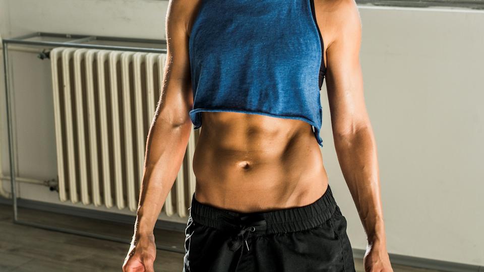 a photo of a woman with strong ab muscles