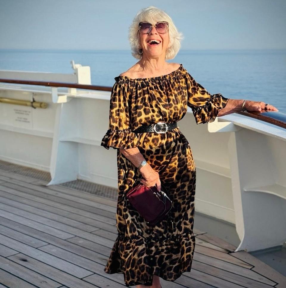 Joan posing on a boat