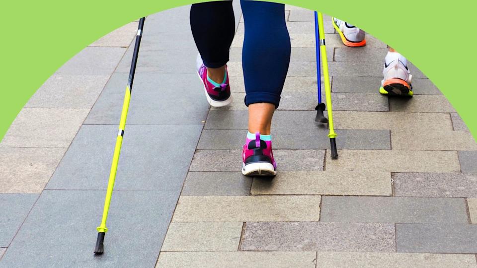 Adding Nordic walking poles to your workout adds upper body muscle engagement that helps boost calorie burn. (Getty Images) 