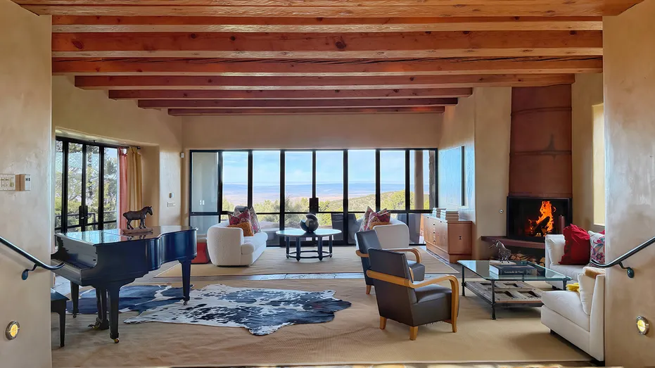 The living room features a beautiful view of the surrounding nature.