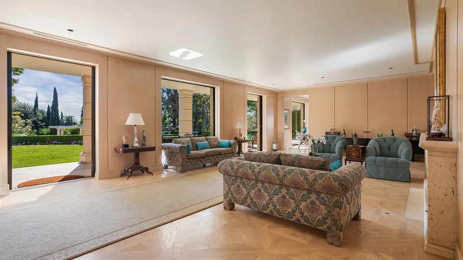 The living room features a fireplace and access to the yard.