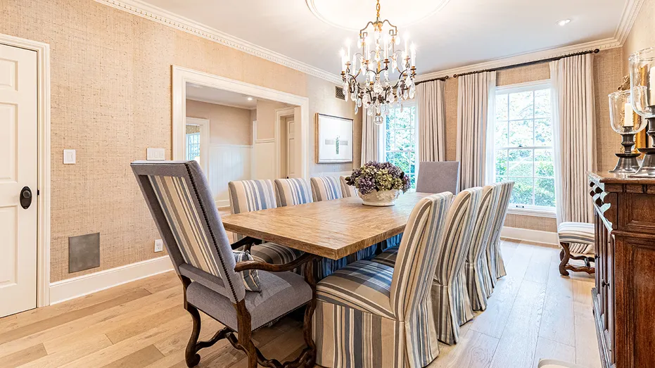 The dining room features a table with enough space for eight diners.