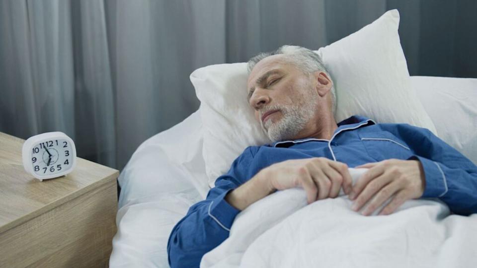 Senior man sleeping in bed, healthy rest during recovery time