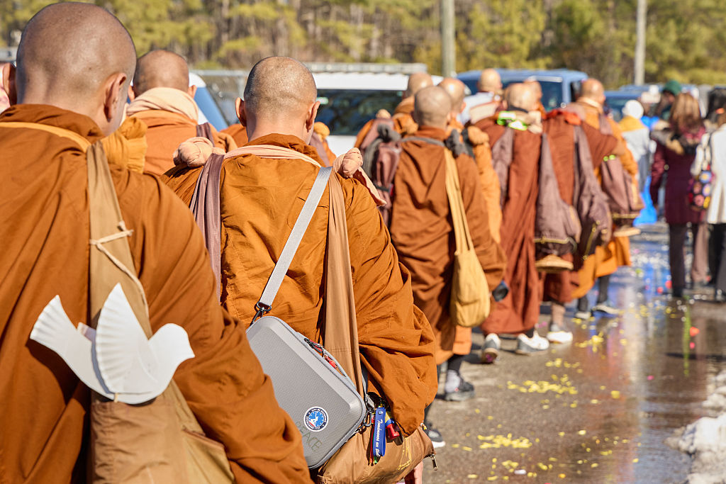 <p>Buddhist monks participate in a “Walk for Peace” in Glen Allen, Virginia, on Feb. 3, 2026. The group is walking from Fort Worth, Texas, to Washington, DC to promote peace, compassion and nonviolence. (Photo by Aaron Mathes / AFP via Getty Images)</p>
