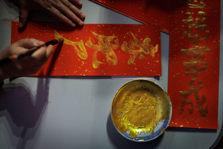 Photos follow the color red through public and intimate spaces during the Lunar New Year