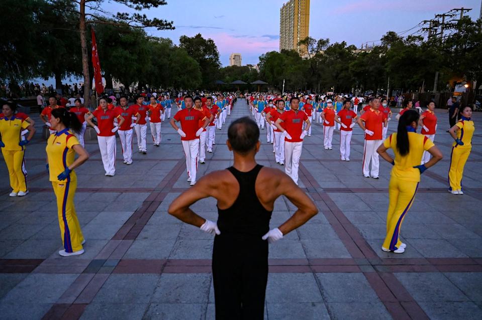 Local residents taking part in an aerobics exercise at a square in Jiamusi, in northeastern China's Heilongjiang (AFP via Getty Images)
