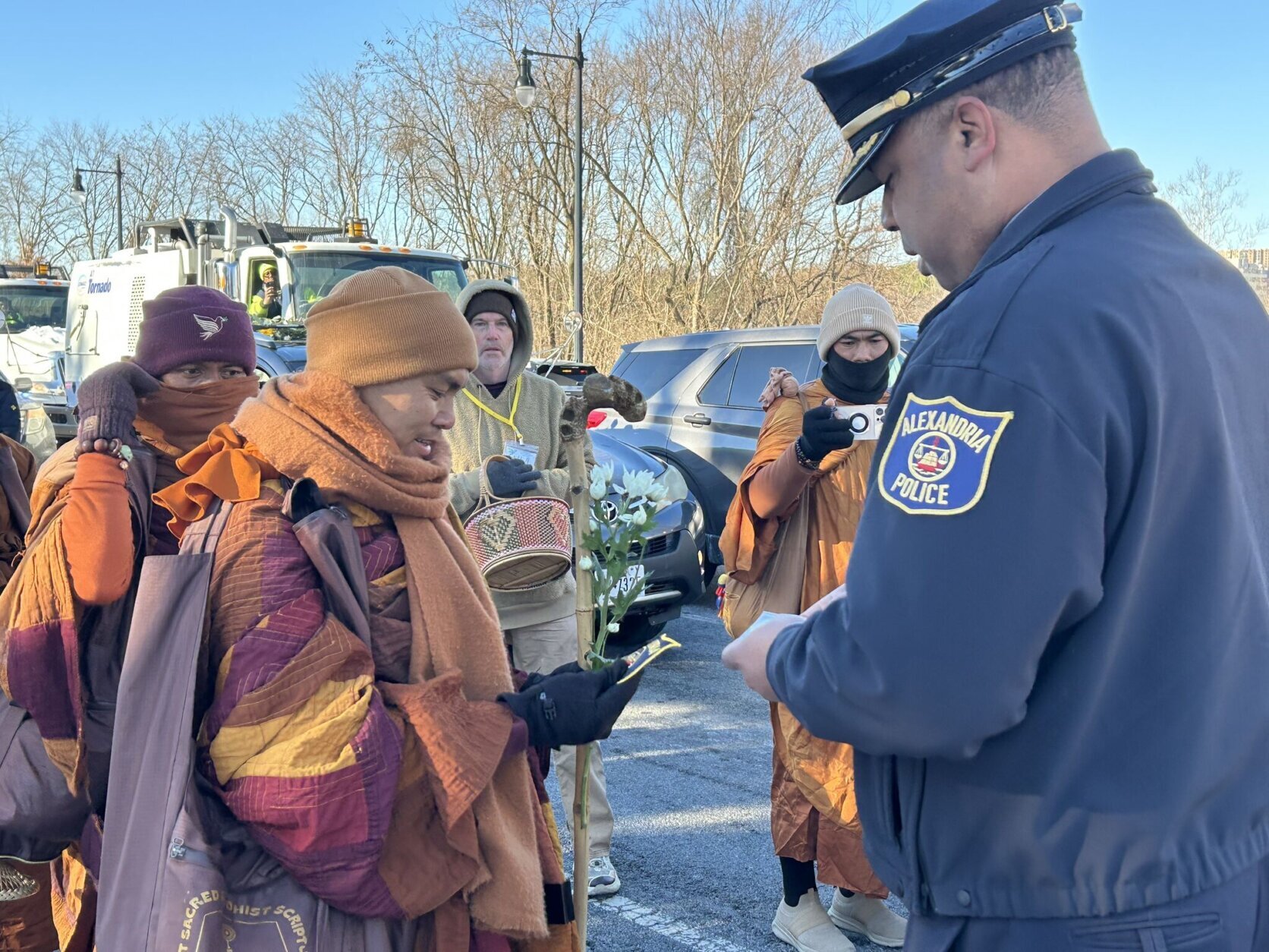 Bhikkhu Pannakara receives a badge from Alexandria Police Chief Tarrick McGuire