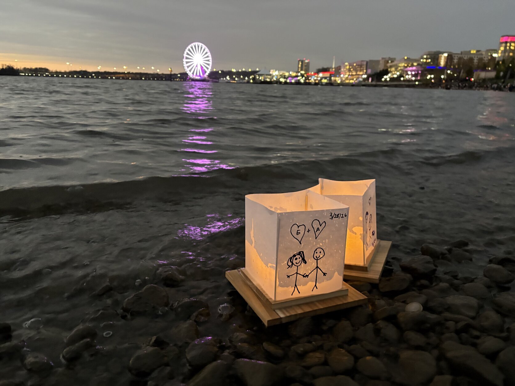 lit paper lanterns on the water