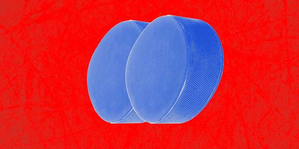 two blue hockey pucks on a red background butt